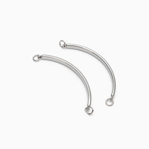 May include: Two silver metal curved connector pieces with jump rings at each end.