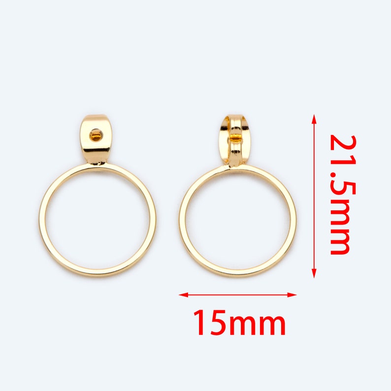 May include: A pair of gold-tone hoop earrings with a diameter of 15mm and a height of 21.5mm.