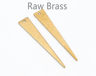 May include: Two raw brass triangle-shaped pendants with a hole at the top.  Raw Brass.