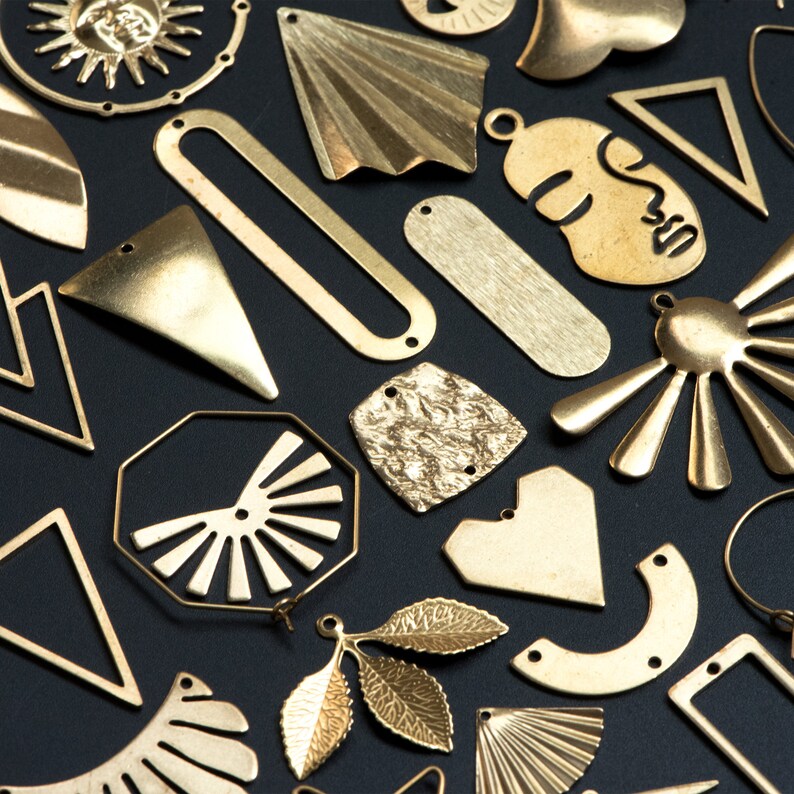 May include: Assortment of gold-toned metal shapes, including stars, hearts, leaves, and geometric designs. These decorative pieces are perfect for crafting jewelry or adding a touch of sparkle to home decor projects.