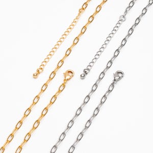 May include: Two gold and two silver chain necklaces with lobster clasps and extension chains.