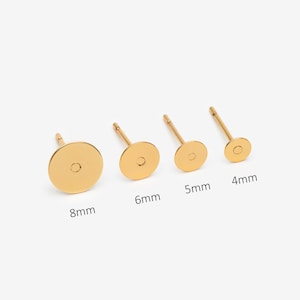 May include: Four gold-colored stud earring findings with flat circular pads for attaching components. The set includes sizes labeled 8mm, 6mm, 5mm, and 4mm, each featuring a thin post extending from the center of the flat circular disc base.