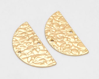 May include: Two gold-toned metal half-circle shapes with a textured surface. Each shape has two holes.