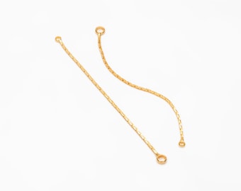 May include: Two gold chain extenders with jump rings at each end.
