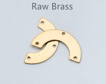 May include: Two raw brass half-circle shapes with three holes each. The text "Raw Brass" is written above the shapes.