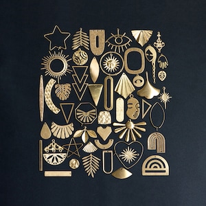 May include: A collection of gold-toned metal earring charms in various shapes, including stars, suns, leaves, geometric shapes, and abstract designs.