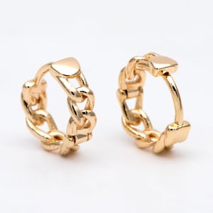May include: A pair of gold hoop earrings with a chain link design.