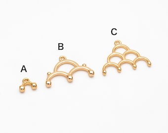 May include: Three gold-toned metal pendant charms in different sizes. The smallest charm is a simple loop with two small balls on either end. The middle charm is a larger loop with three small balls on either end. The largest charm is a triangular shape with three rows of loops, each with a small ball on either end.