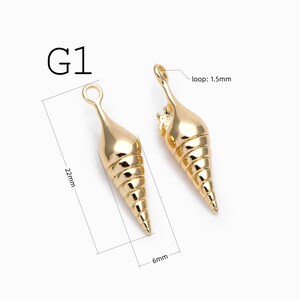 May include: Two gold-colored metal shell charms labeled G1. Each charm features a spiral cone shape with a top loop measuring 1.5mm. The total length of the charm is 22mm and the width is 6mm, as indicated by the technical lines.