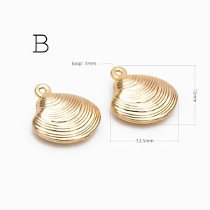 May include: Two gold-toned metal seashell charms labeled B. Each charm features a ribbed texture and a small circular loop. Dimensions are indicated as 15mm in height, 13.5mm in width, and a 1mm loop diameter for the jewelry components.