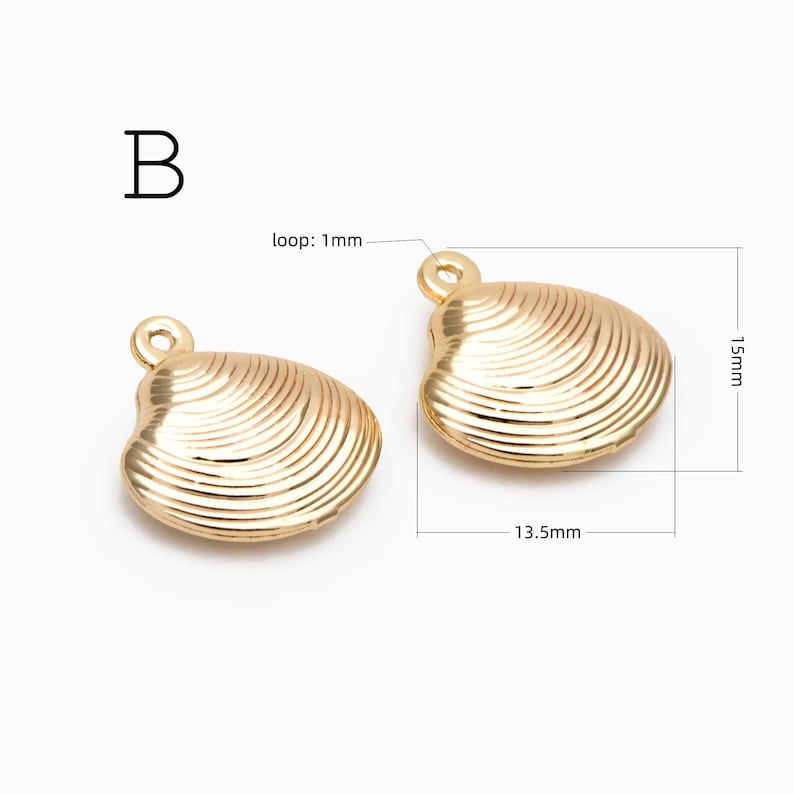 May include: Two gold-toned metal seashell charms labeled B. Each charm features a ribbed texture and a small circular loop. Dimensions are indicated as 15mm in height, 13.5mm in width, and a 1mm loop diameter for the jewelry components.