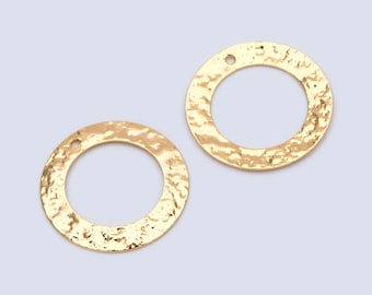 May include: Two gold-toned metal circles with a hammered texture and a small hole at the top.