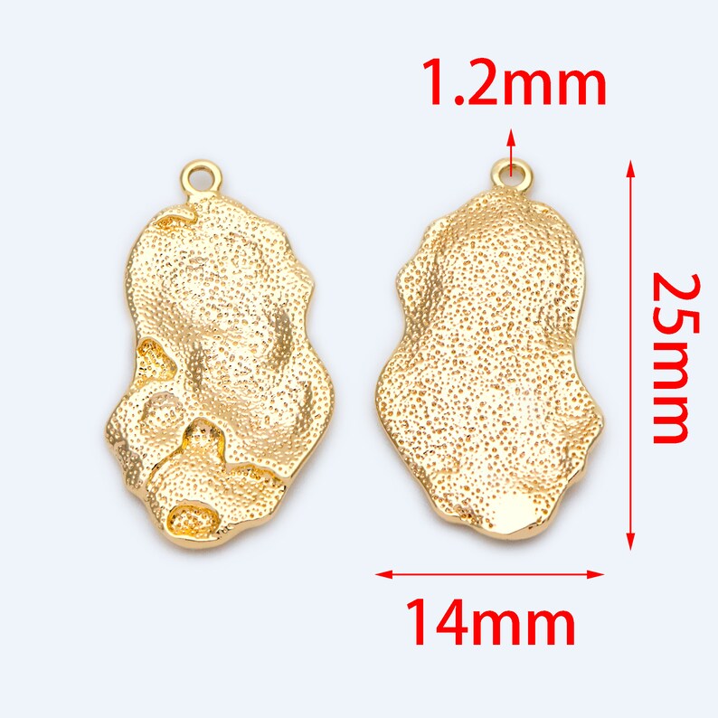 May include: Two gold-tone metal pendant charms with a textured, irregular oval shape. Each charm measures 1.2 inches in length and 1.4 inches in width.