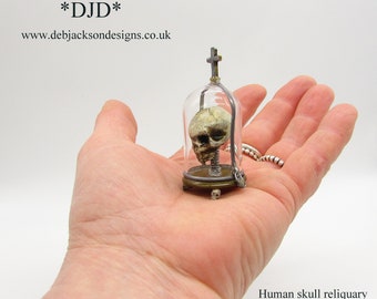 From *DJD* ,12th scale human skull reliquary