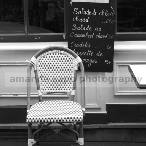 french cafe chair black and white photo