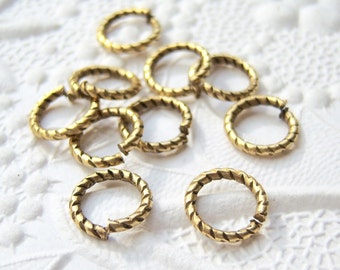 10 - Fancy jump rings antique gold etched 9mm 16 ga.- EO90