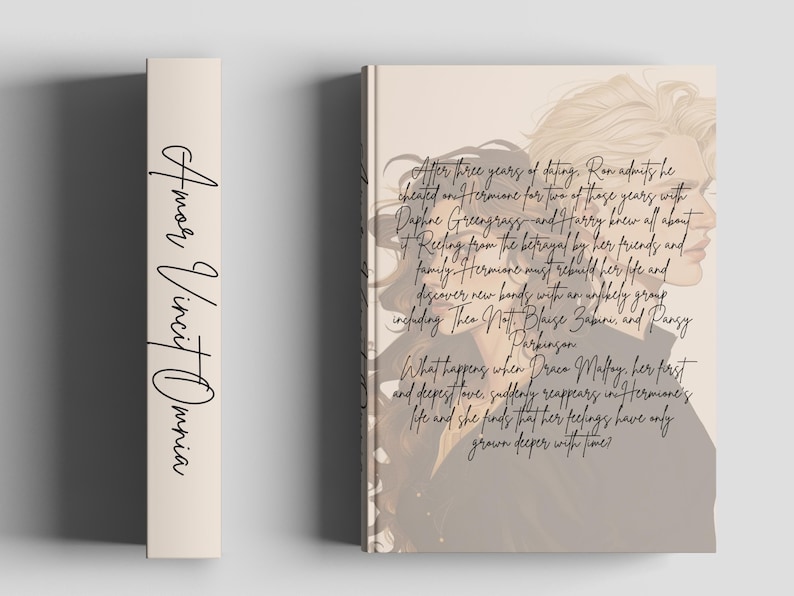 May include: A book with a beige spine featuring the words "Amor Vincit Omnia" in black script. The book cover displays a side profile of a person with text describing a story of betrayal and rediscovery.