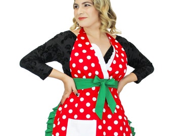 May include: Red and white polka dot apron with a green bow and a white pocket. The apron has a ruffled green trim.