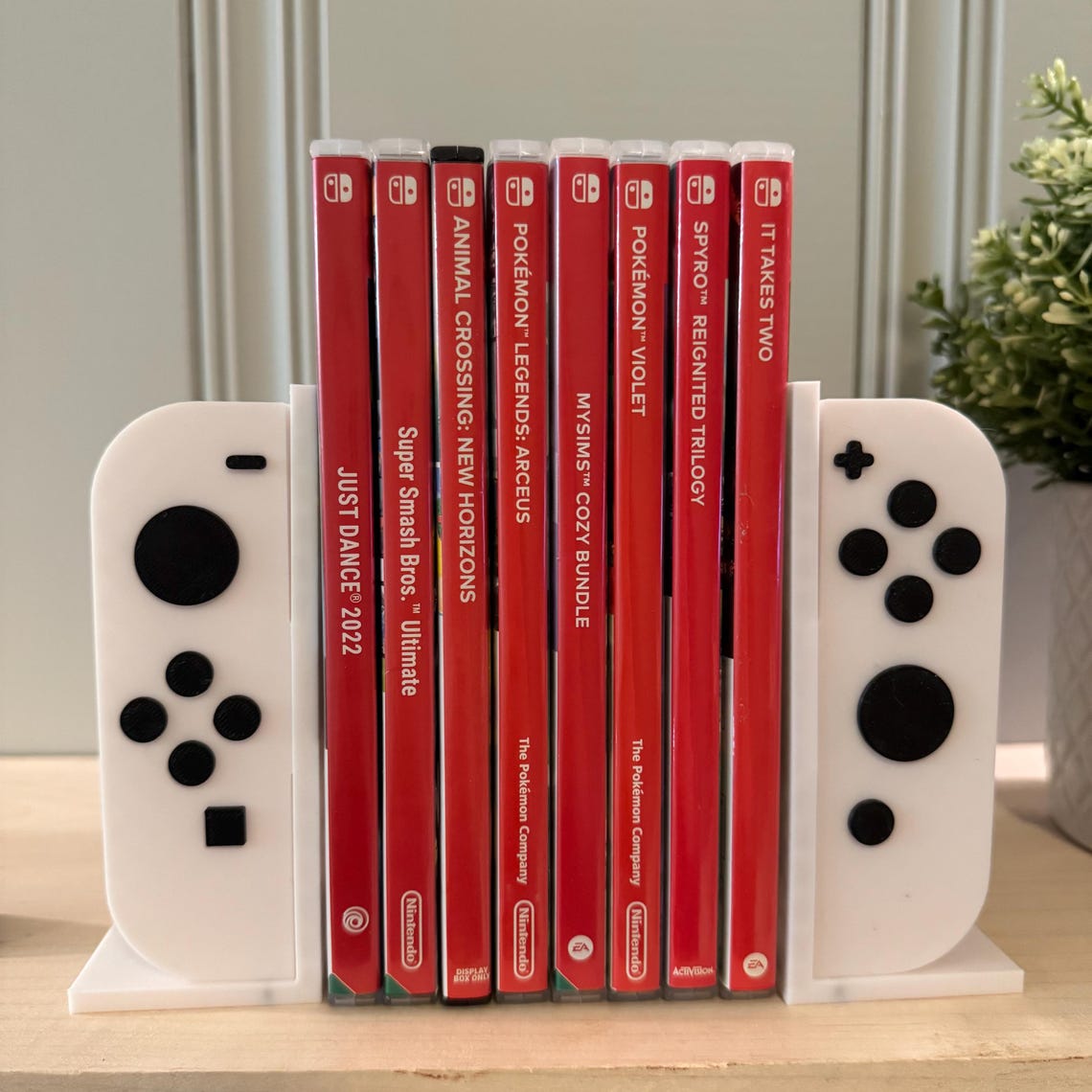 Switch controller-shaped bookends for gaming enthusiasts.