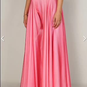 May include: A pink wide-leg palazzo pant with a high waist and a flowing, A-line silhouette.