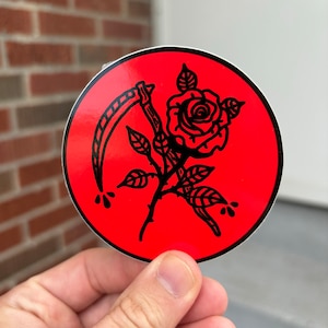 Scythe and rose sticker. Death and rebirth sticker. Traditional tattoo flash sticker.