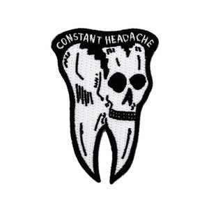 May include: Black and white embroidered patch of a tooth with a skull inside. The text "CONSTANT HEADACHE" is above the tooth.