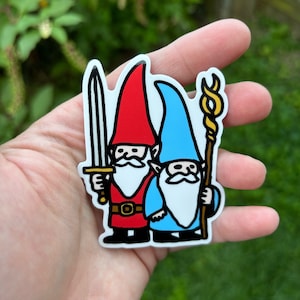 May include: Two gnomes, one wearing a red hat and holding a sword, the other wearing a blue hat and holding a golden staff.