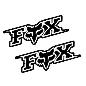 May include: Two black and white Fox Racing stickers with the word "FOX" and a fox head logo.
