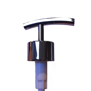 May include: A chrome-finished pump dispenser head with a curved handle. The pump has a cylindrical base and a white plastic tube extending downwards. The design is sleek and modern, suitable for various liquid products.