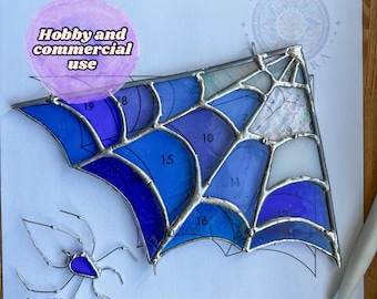 May include: A stained glass spider web corner pattern in blue and white with instructions for hobby and commercial use. The pattern includes numbers for each piece of glass.