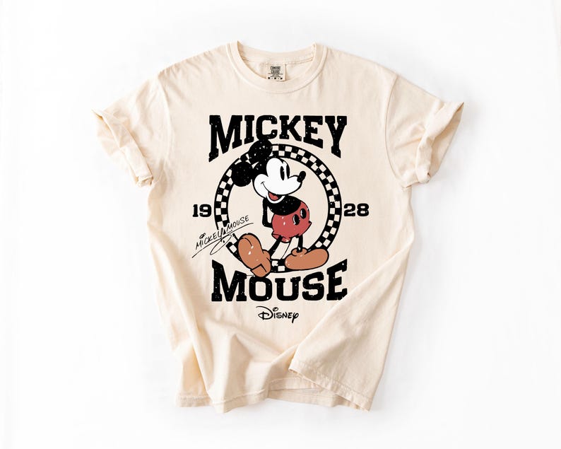 a mickey mouse t - shirt on a white background