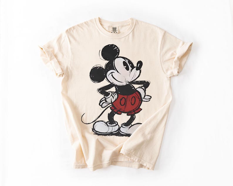 a white shirt with a mickey mouse on it