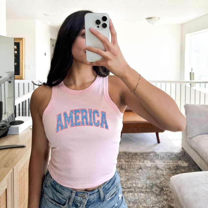 a woman taking a selfie in a living room