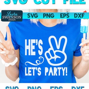 May include: Blue t-shirt with the text "HE'S 2" and a peace sign graphic. The words "LET'S PARTY!" are below the graphic. The image also includes the text "CRICUT & SILHOUETTE SVG CUT FILE" and file type options.
