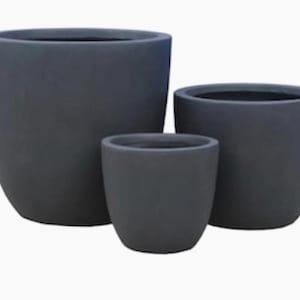 May include: Three gray ceramic planters of different sizes. The planters are round and have a smooth, matte finish.