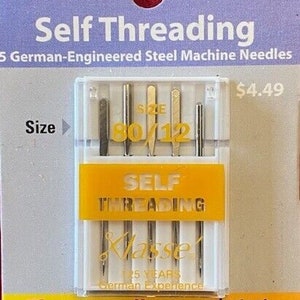 May include: A package of 5 self-threading sewing machine needles, size 80/12, made of German-engineered steel. The package is yellow and white with the text "Self Threading" and "Klasse! 25 Years German Experience".