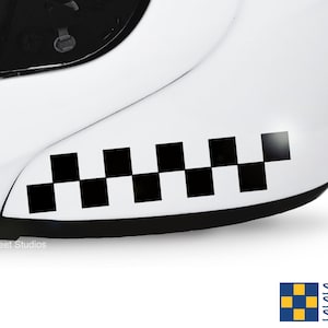 May include: White motorcycle helmet with a black and white checkered racing stripe decal on the side.