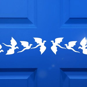 May include: A white vinyl stencil of a row of flying dragons, perfect for adding a whimsical touch to a door or wall.