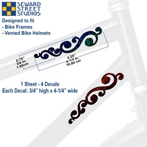 May include: A set of four holographic scroll decals for bike frames and vented helmets. Each decal measures 0.75 inches high by 4.25 inches wide. The image displays one blue and one red decal applied to a white bicycle frame, with text indicating Seward Street Studios and sizing details.