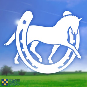 May include: White silhouette of a horse jumping over a horseshoe. The image is on a blue and green background with the text "Seward Street Studios" at the bottom.