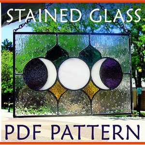 May include: A stained glass window pattern featuring three crescent moons in shades of purple, black, and white, surrounded by green and yellow glass. The pattern is titled "STAINED GLASS PDF PATTERN".