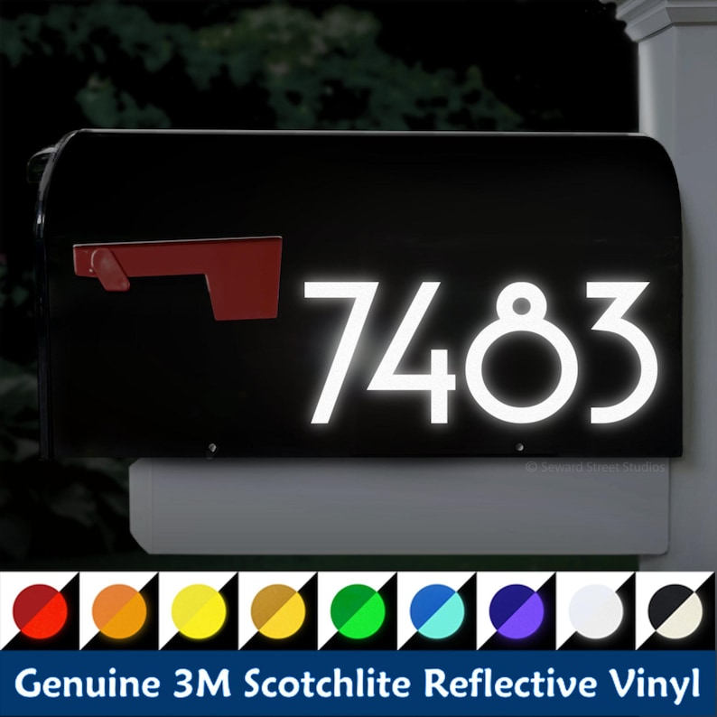May include: White reflective vinyl house numbers 7483 on a black mailbox. The numbers are made with 3M Scotchlite reflective vinyl and are available in a variety of colors.