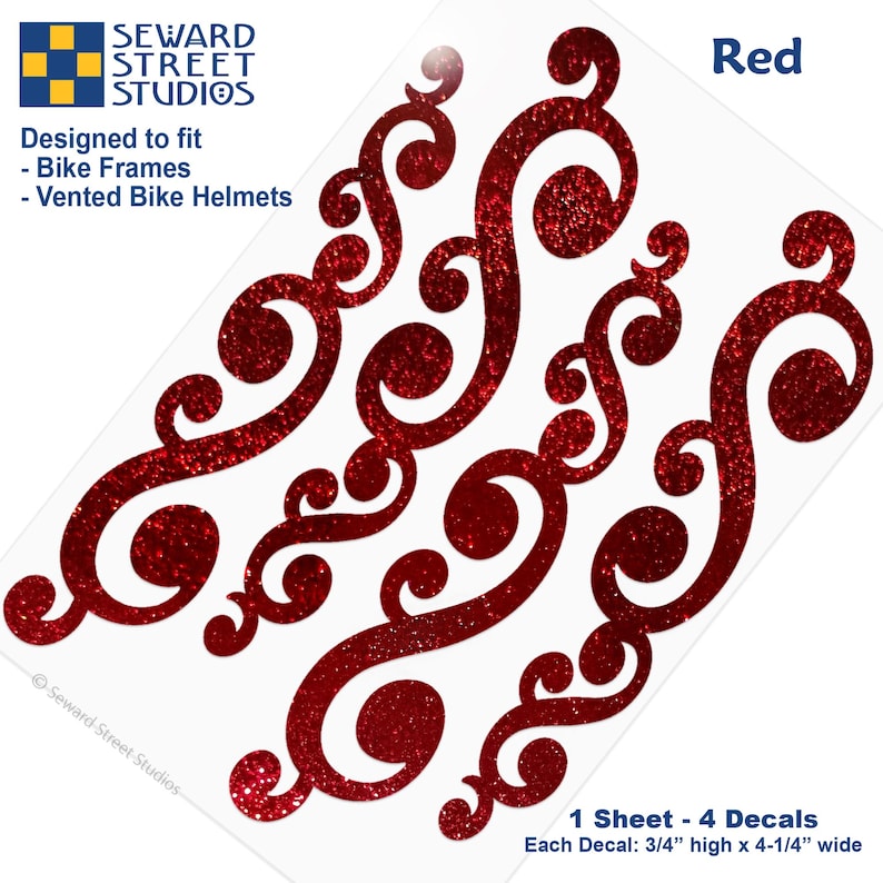 May include: A sheet of four red glittery scrollwork decals designed for bike frames and vented bike helmets. Each decal measures 0.75 inches high by 4.25 inches wide. The text Seward Street Studios, Designed to fit, Bike Frames, Vented Bike Helmets, and Red are visible.