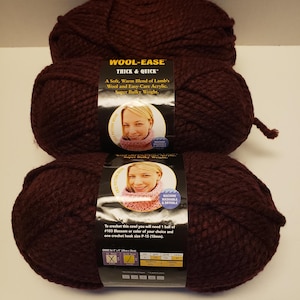 May include: Three balls of Wool-Ease Thick & Quick yarn in the color #103 Blossom. The yarn is a super bulky weight and is machine washable and dryable. The label includes instructions for crocheting a cowl.