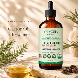 May include: A 4 fl oz amber glass bottle of Velvoria Naturals Castor Oil with Rosemary featuring a black dropper cap. The label states Certified Organic, Cold Pressed, Hexane Free, for skin, hair, and nails. Includes a small bowl of oil and seeds.