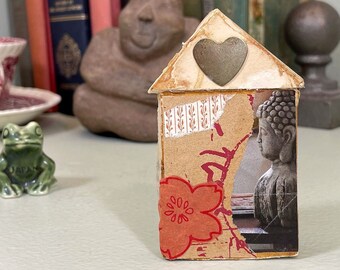 Small Buddha collage on vintage book pages cut into a house shape, with heart. Stand alone mixed media assemblage.
