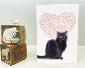 Black cat love card for anniversary, thinking of you, or any occasion. The background is a dictionary page heart. Small card, blank inside.