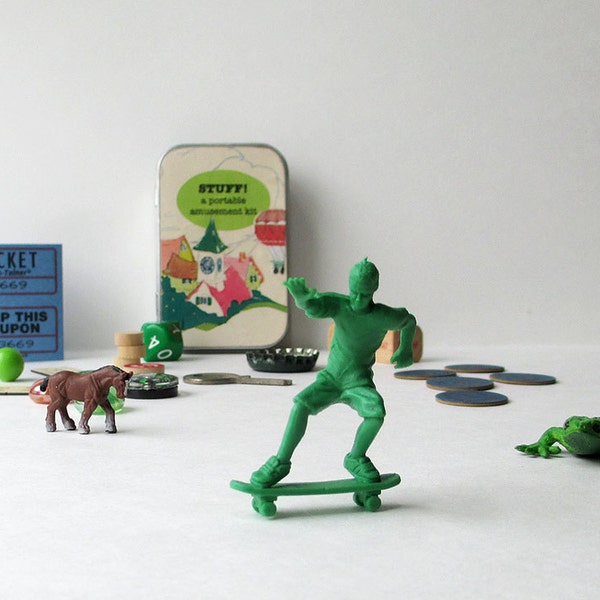 Toys in a little box, with green skateboarding dude, lizard, tiny horse, and other fun objects // option to personalize