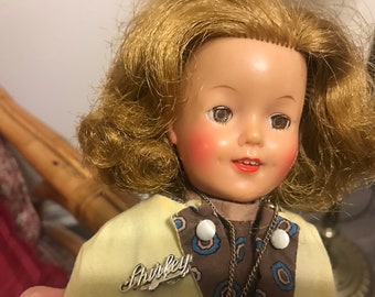 1950s Shirley Temple 12-inch doll and wardrobe