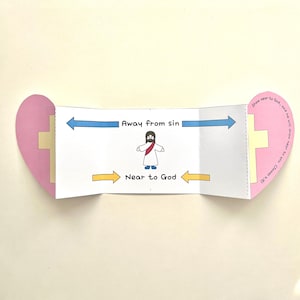 Puede incluir: Una manualidad de papel plegado con un extremo en forma de corazón y un diseño de cruz. El panel central presenta una ilustración de dibujos animados de Jesús con los textos "Lejos del pecado" y "Cerca de Dios" con flechas direccionales.